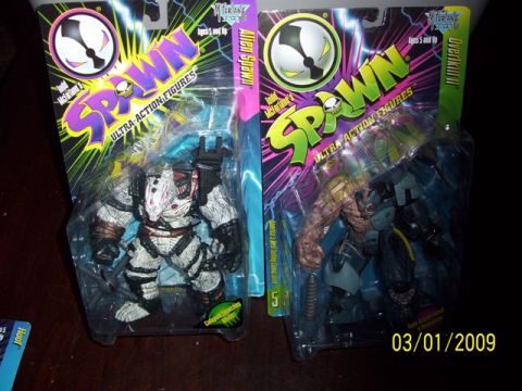 1991 Ford Bronco - Two collectible Spawn action figures are displayed in their original packaging.