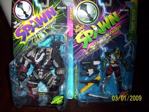 1991 Ford Bronco - Two collectible Spawn action figures are displayed in their original packaging, ready for collectors.
