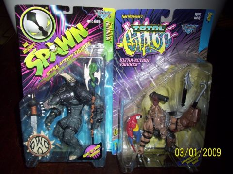 1991 Ford Bronco - Two action figures, Spawn and Total Chaos, are displayed in their original packaging.