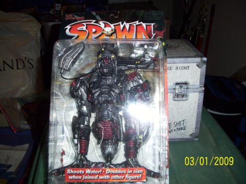 1991 Ford Bronco - A Spawn action figure is displayed in its original packaging, with text indicating its features.