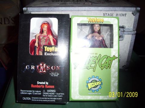 1991 Ford Bronco - Two collectible action figures, Crimson and Lady Death, are displayed in their original packaging.