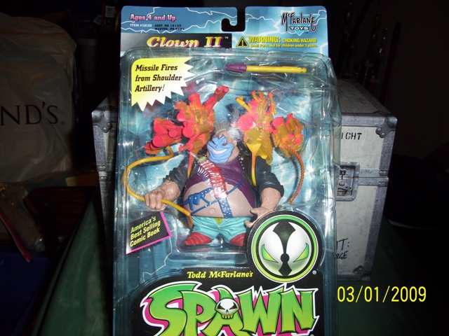Clown II action figure in packaging with "Missile Fires from Shoulder Artillery!" text