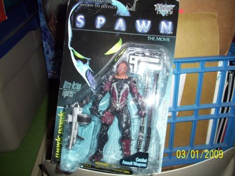 1991 Ford Bronco - Spawn action figure from "The Movie" line, packaged with combat assault weapons.