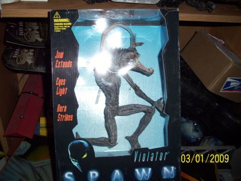 1991 Ford Bronco - A Spawn Violator action figure is displayed in its original packaging, showing its features.