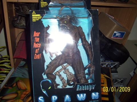 1991 Ford Bronco - A Spawn Malebolgia action figure is displayed in its original box, with a date stamp of 03/01/2009 visible.