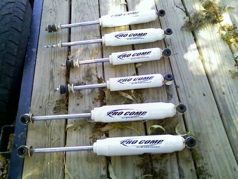 1996 Ford Bronco - Set of six Pro Comp ES3000 shock absorbers for sale, shown on a wooden surface.