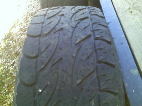 1996 Ford Bronco - Close-up view of a tire tread pattern.