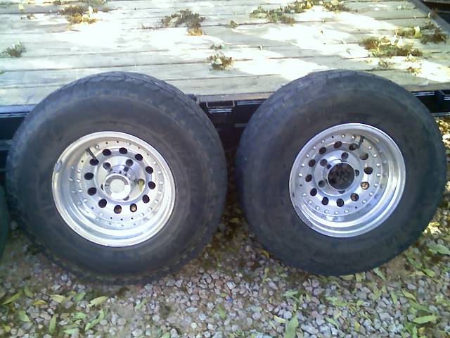 Two aftermarket aluminum rims with tires