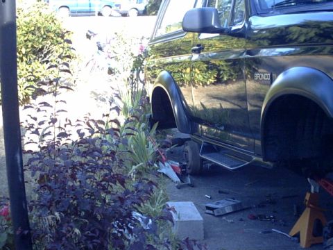 1995 Ford Bronco - Carnage. The Highlift tilted the rig off the jack stands right onto the rear drums.