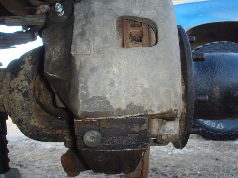 1978 Chevrolet C/K Pickup - Close-up view of a Dana 60 axle's brake caliper and rotor assembly.