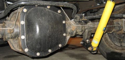 2007 Ford Mustang - Underbody photograph of a rear differential and shock absorber, not a technical document.