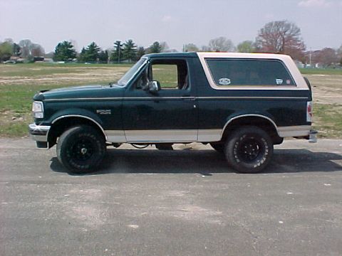 1993 Ford Bronco - This 1993 Ford Bronco is shown from the side, a two-tone paint scheme of dark green and tan.