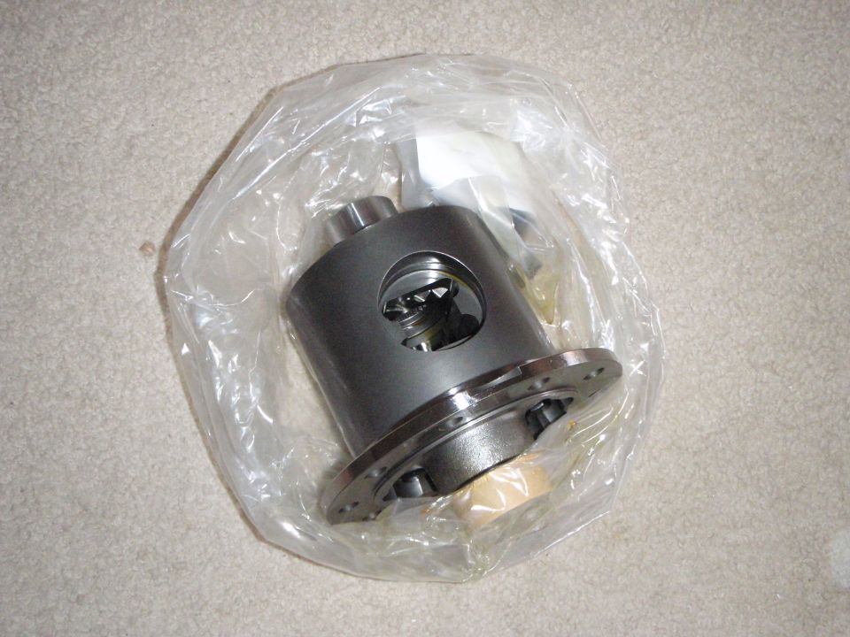 Differential carrier in plastic bag on carpet