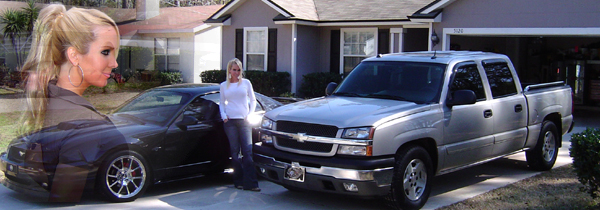 Black coupe and silver Chevrolet crew-cab pickup in a driveway, edited with overlay