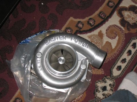 2001 Pontiac Trans Am - Close-up of a turbocharger, likely a performance part for a vehicle.