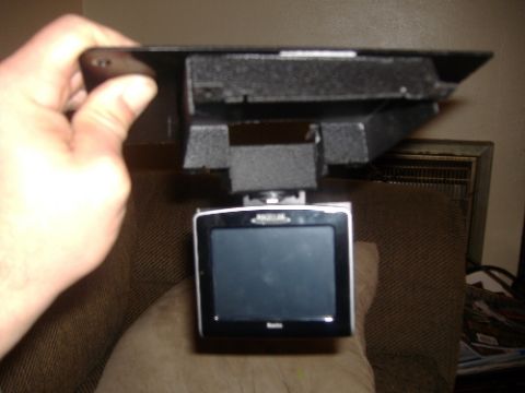 1997 Ford Crown Victoria - A dashcam is held up, showing its screen with readable text.
