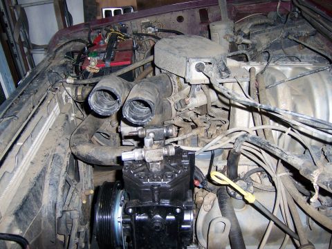 1991 Ford Bronco - Engine bay of a 1991 Ford Bronco, showing various components and wiring.