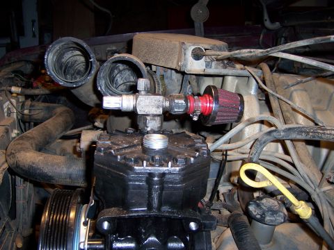 1991 Ford Bronco - Aftermarket air intake components are visible in the engine bay, obscuring the vehicle's specific year and model.
