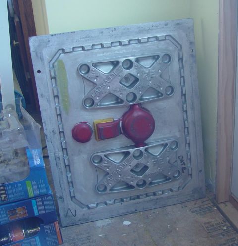 1969 Ford Fairlane - A metal mold, possibly for manufacturing, features red and yellow components and is marked with 'CAPSADDLE' and 'REX'.