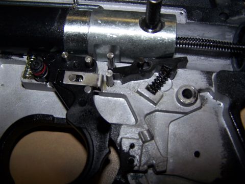 1986 Ford Bronco - Detailed view of a firearm's internal trigger assembly, showing intricate mechanical components.