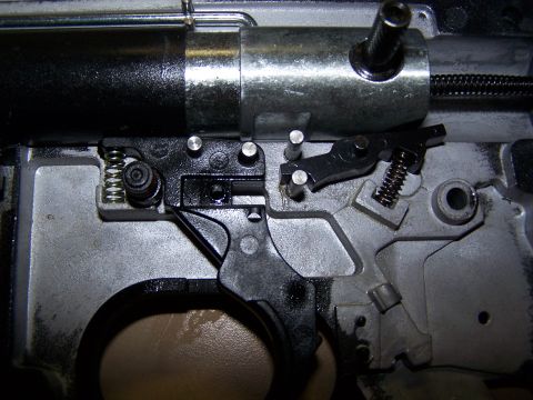 1986 Ford Bronco - Internal components of a firearm's trigger assembly are visible in this close-up view.