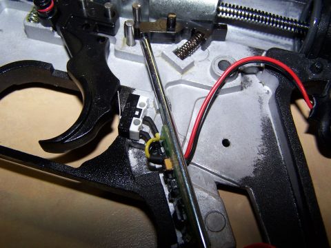 1986 Ford Bronco - Internal mechanism with trigger, spring, and electrical wiring visible.