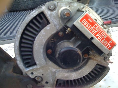 1984 Ford F-250 - Close-up of an alternator, a critical electrical component for vehicles.
