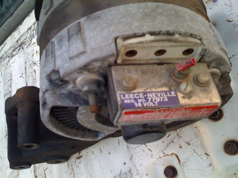 Leece-Neville alternator with registration number 77973 and 14 VOLT label