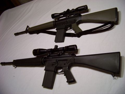 1995 Mercury Grand Marquis - Two rifles with scopes are shown on a white background.