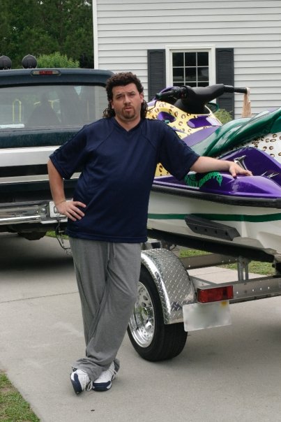 1981 Garelli Rally Sport - A man poses with a jet ski and trailer, parked in front of a house with a truck nearby.