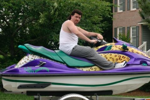 1981 Garelli Rally Sport - A man sits on a jet ski with a leopard print design.