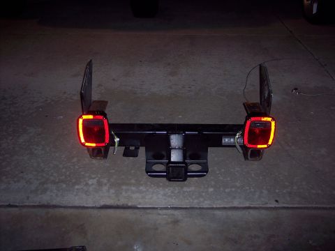 1981 Kenworth W900A - This trailer hitch assembly features red tail lights and amber turn signals, likely for a truck or heavy-duty vehicle.