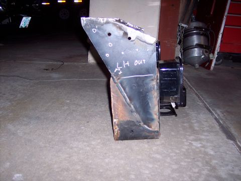 1981 Kenworth W900A - A welded metal bracket with markings is shown in a garage setting.