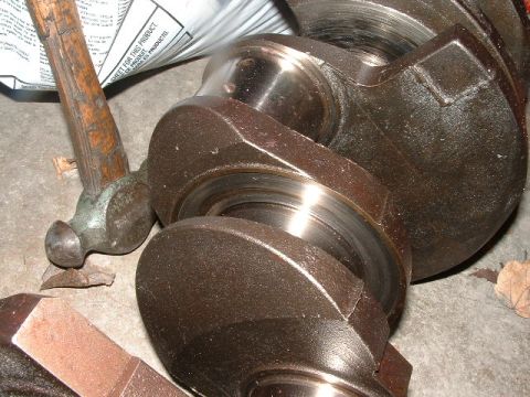 1978 Ford Ranchero - A crankshaft is shown with a hammer and other tools, suggesting a repair or disassembly process.