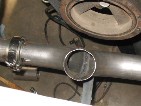 2001 Pontiac Trans Am - Close-up view of a custom exhaust pipe installation, showing a turbocharger component in the background.