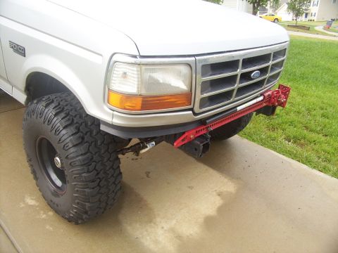 1995 Ford Bronco - Front view of a 1995 Ford Bronco equipped with a Hi-Lift jack and off-road tires.