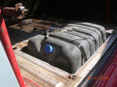 1985 Ford Bronco - Fuel tank installation in progress, showing the tank and its connections.