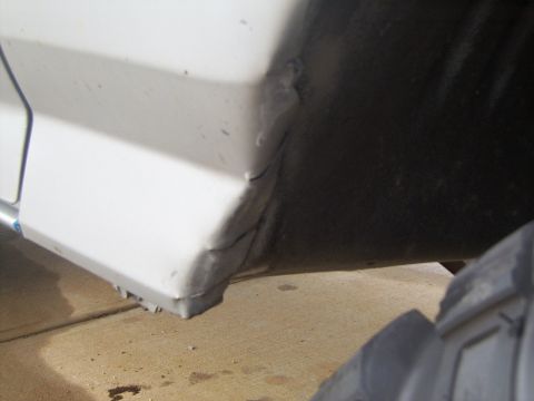 1995 Ford Bronco - Used the sawzall to cut horizontal slits, then just hammered them in and painted over to prevent rust. Looks rough, but it works.
