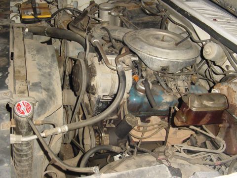 1982 Ford Bronco - Close-up view of a V8 engine bay, showing various components and wiring.