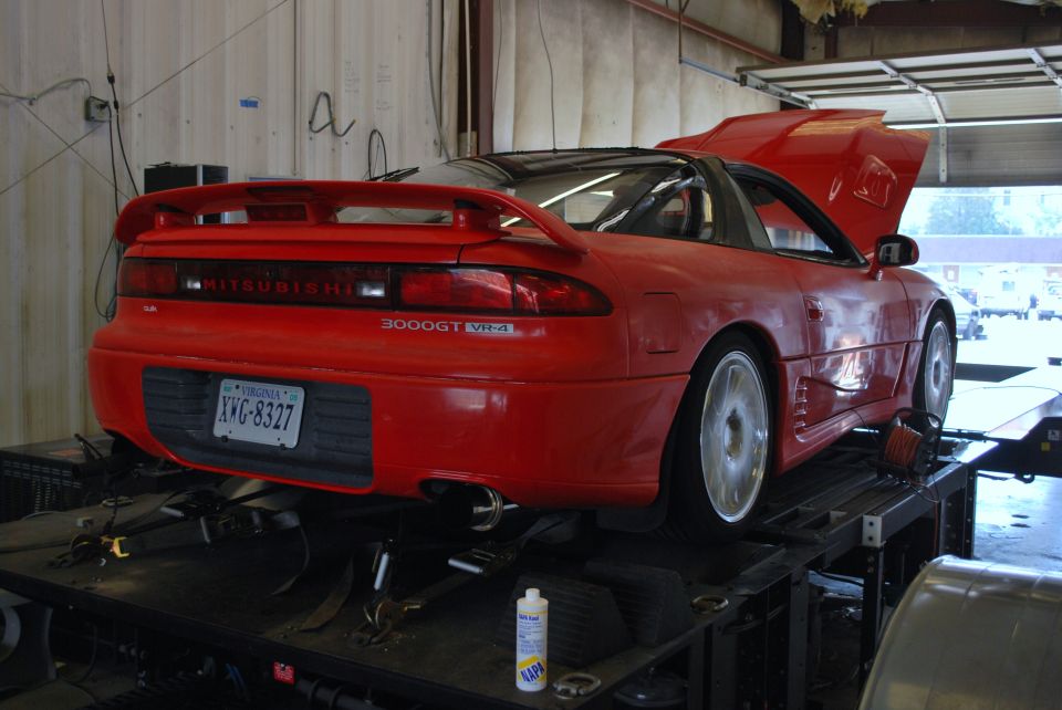 Red 1991 Mitsubishi 3000GT on a dynamometer, rear view. Virginia license plate XWG-8327