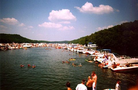 1982 Ford Bronco - A crowded lake scene with numerous boats and people enjoying the water on a sunny day.