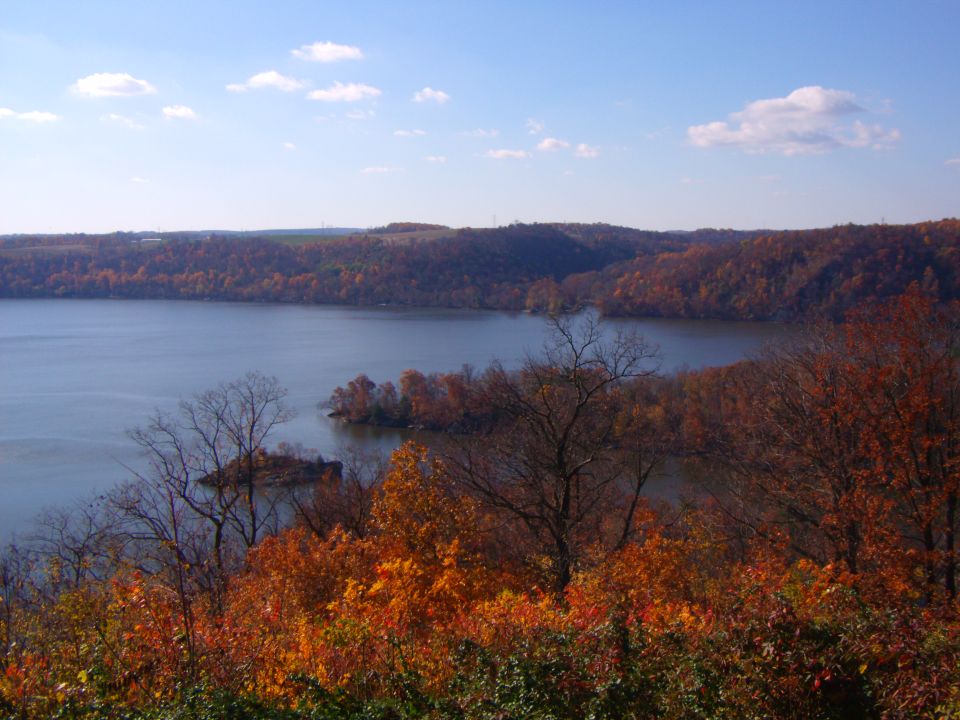 Lake surrounded by colorful autumn trees.
