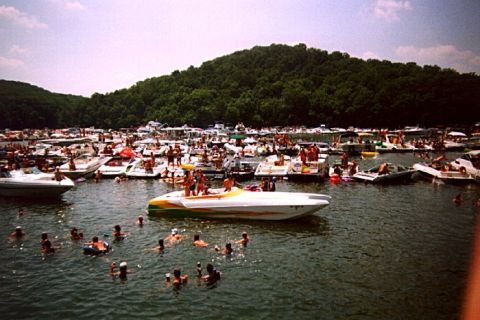 1982 Ford Bronco - A crowded lake scene with numerous boats and people enjoying the water on a sunny day.