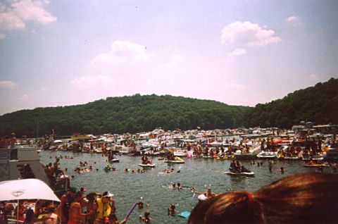 1982 Ford Bronco - A crowded lake scene with numerous boats and people enjoying the water on a sunny day.