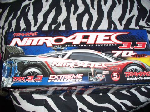 1990 Ford Bronco - The image shows the box for a Traxxas Nitro 4-Tec 3.3 All-Wheel-Drive Supercar, featuring a graphic of the remote-controlled car. The box i…