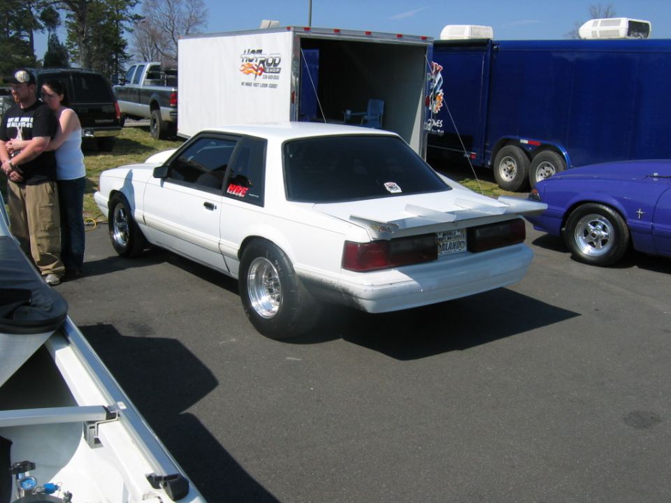 White Fox-body Mustang notchback drag car in a paddock