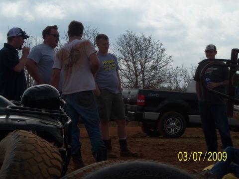 1996 Ford Bronco - People gather around a pickup truck and ATV on a cloudy day, with a date stamp of 03/07/2009.