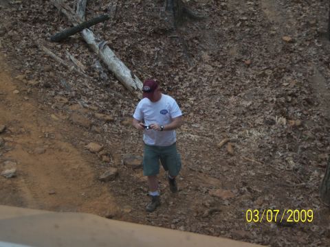 1996 Ford Bronco - A man stands on a wooded hillside, holding a camera, with a date stamp of March 7, 2009 visible in the lower right corner.