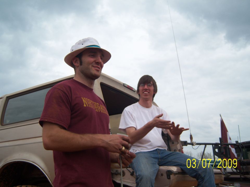 1996 Ford Bronco side view with two men standing nearby