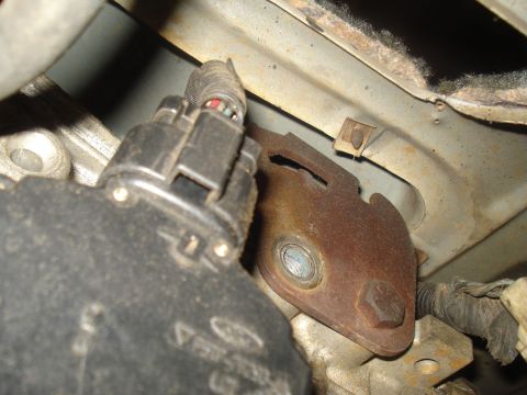 1991 Ford Bronco - Vehicle part detail showing electrical connector and mounting bracket.